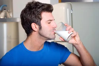 man drinking milk