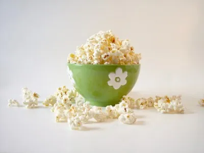 popcorn in a green bowl.