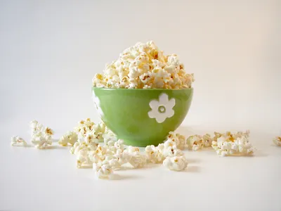 popcorn in a green bowl.