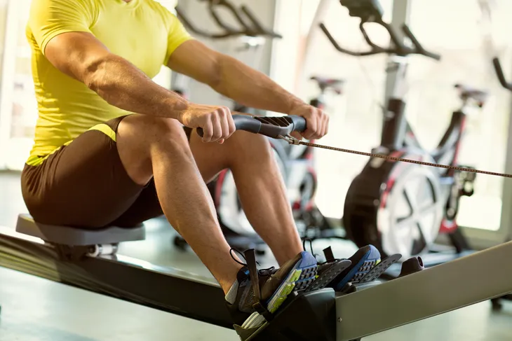 Man Using The Rowing Machine