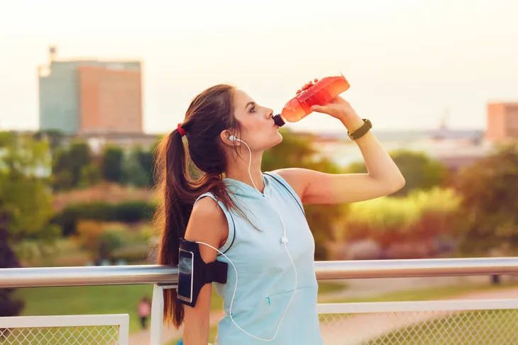 Woman drinking sports drink