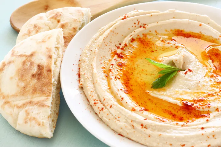 Bowl of hummus and pita bread