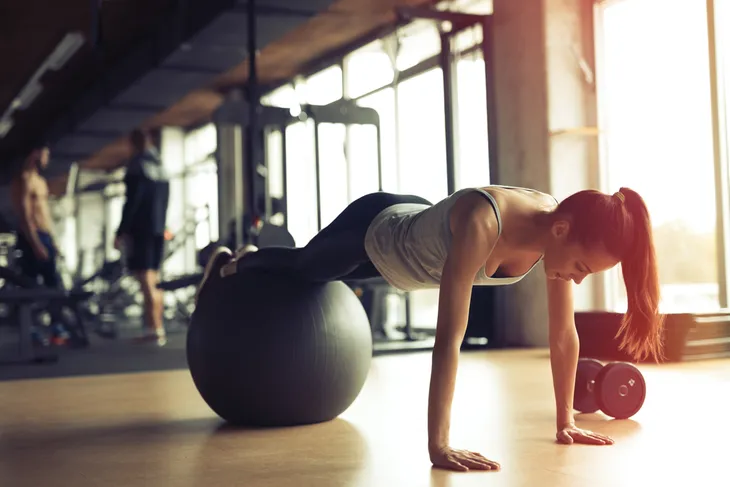 Woman balancing on an exercise ball