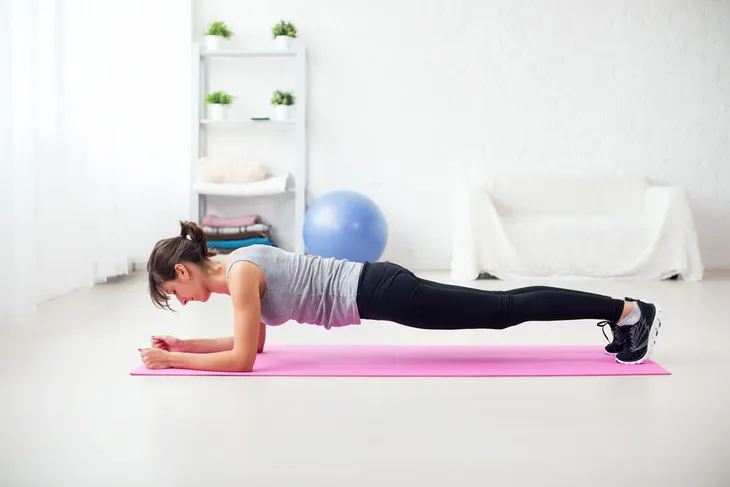 low impact exercise: woman performing plank