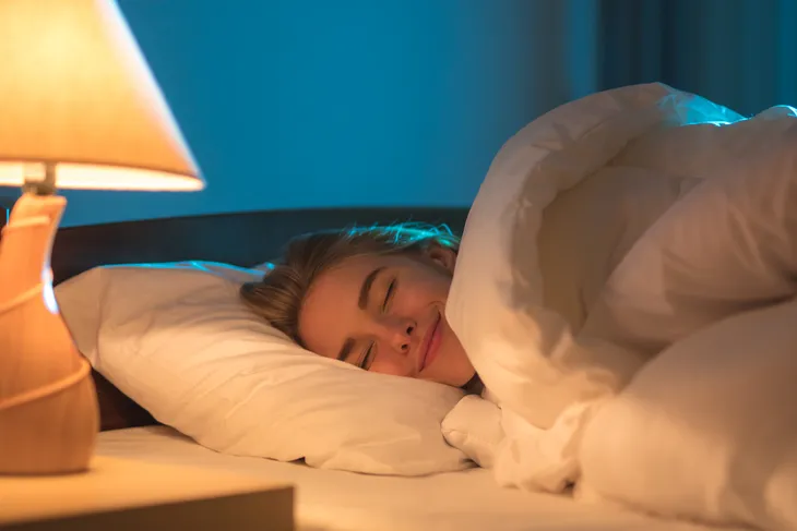 Woman happy sleeping in bed