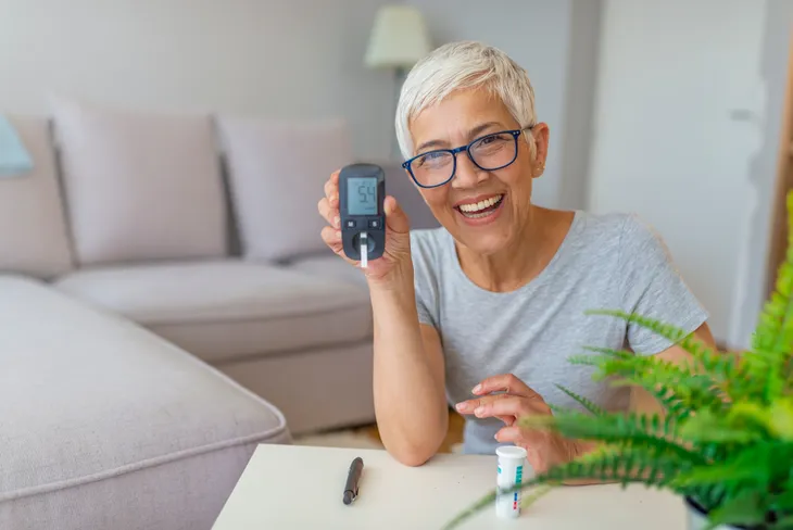 Diabetic woman checking blood sugar levels