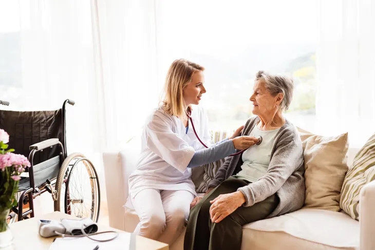 in-home health care, nurse taking care of woman