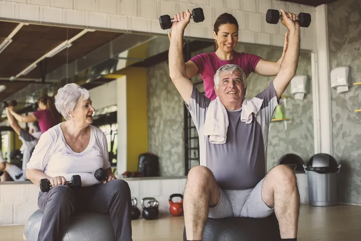 senior couple strength training to lose weight
