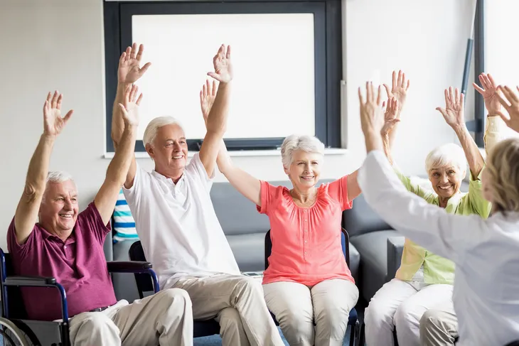 Group of seniors doing Seated Side Bends