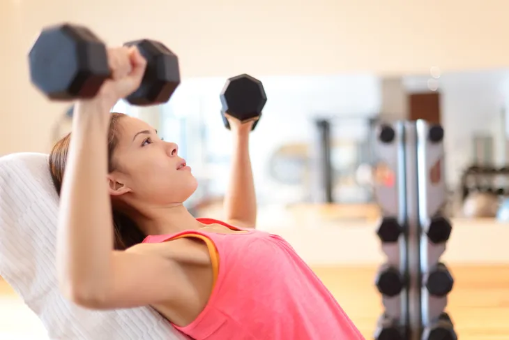 Woman Doing Dumbbell Shoulder Press