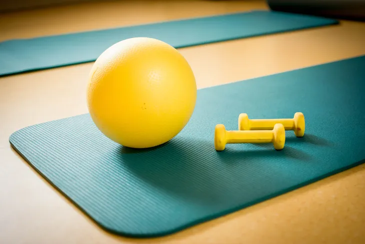 medicine ball, dumbbells, and yoga mat
