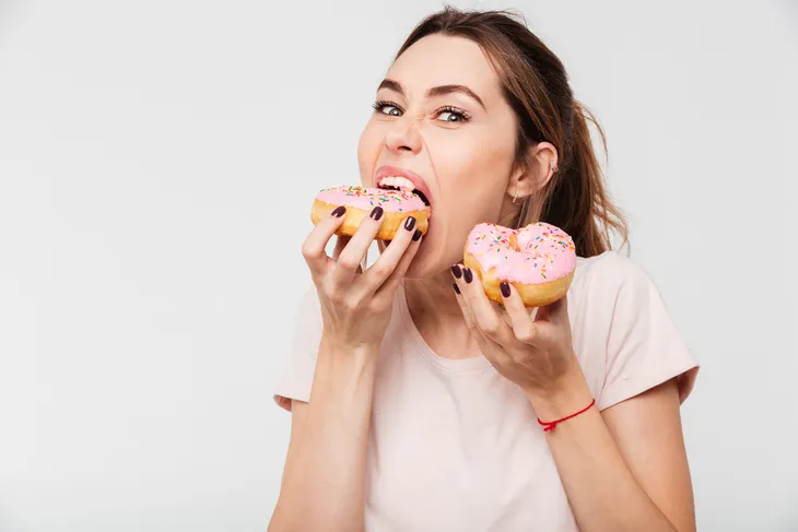 woman eating donuts