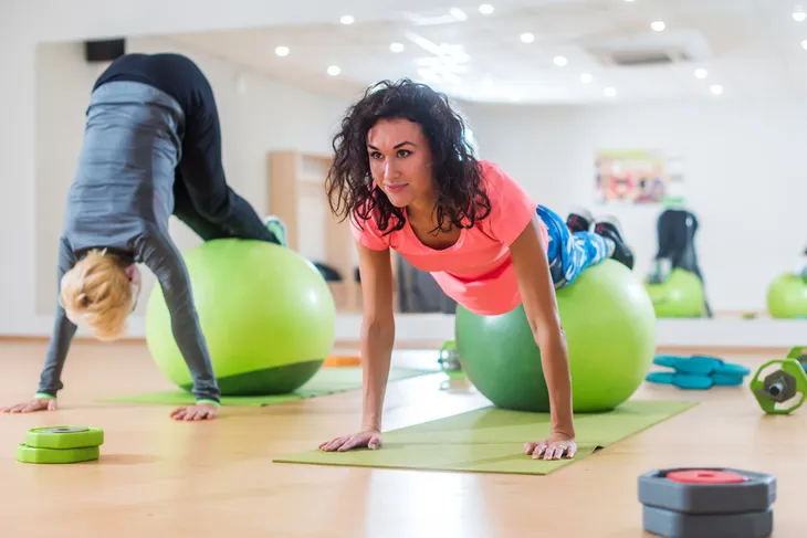 women exercising on stability ball