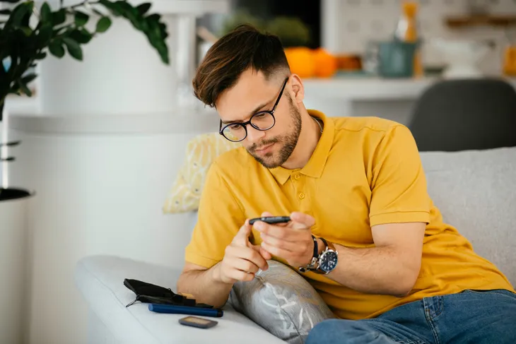 Diabetic man testing sugar levels