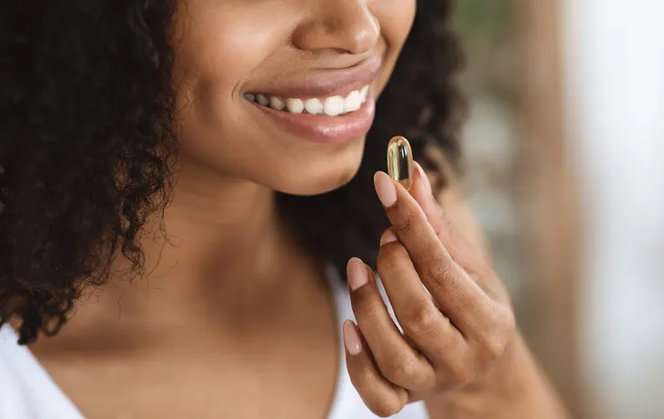 woman taking supplement